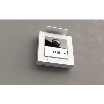 A square doorbell with a camera and a sign reading 'Name'.