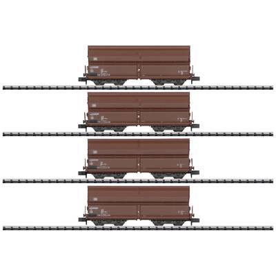 Four brown freight wagons on parallel tracks.