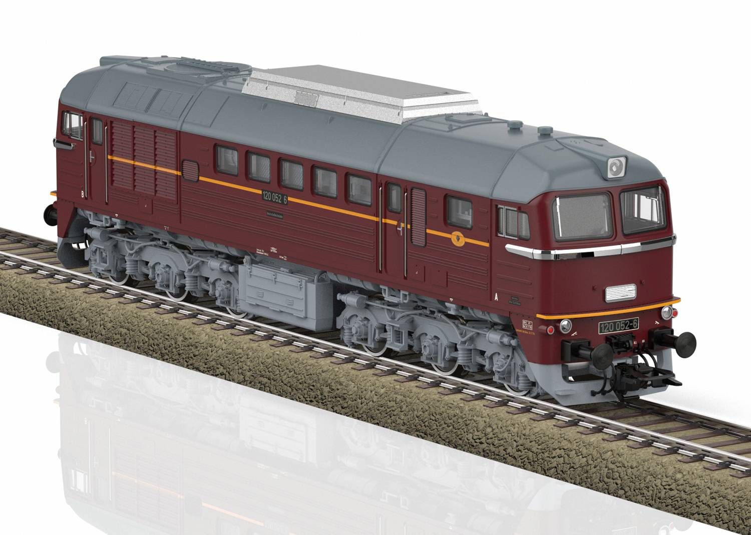 A red model train on tracks, with intricately designed windows and wheels, displayed on a plastic track section.