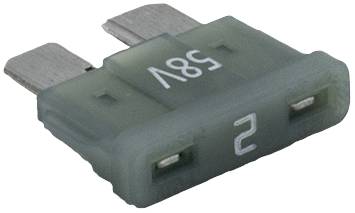 A green flat fuse with '32V' and '2' printed on it. Silver metal contacts are visible at both ends.