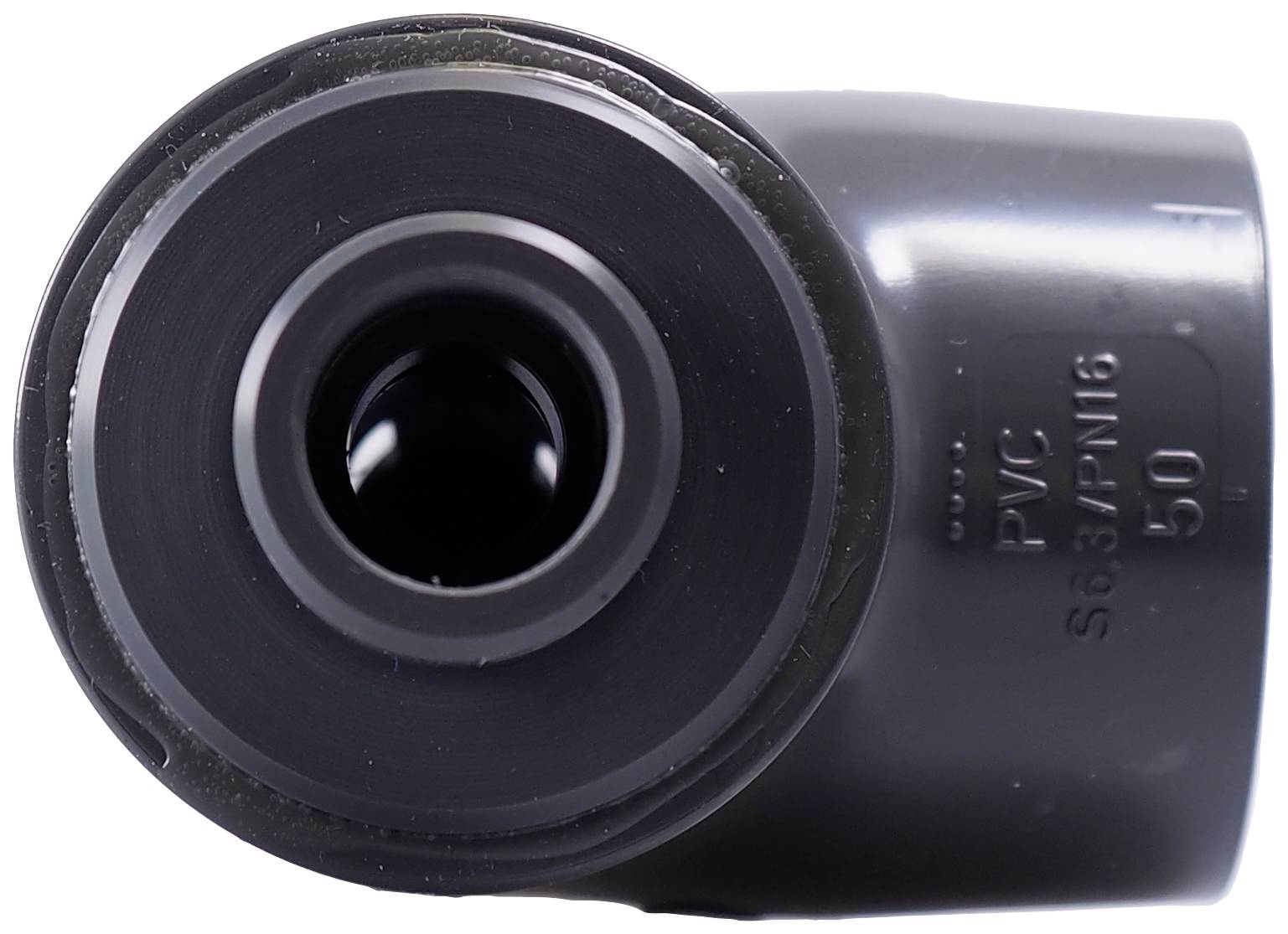 Black PVC pipe section with embossed inscription 'PVC S63/PN16 50'. Front view shows the round end of the pipe.