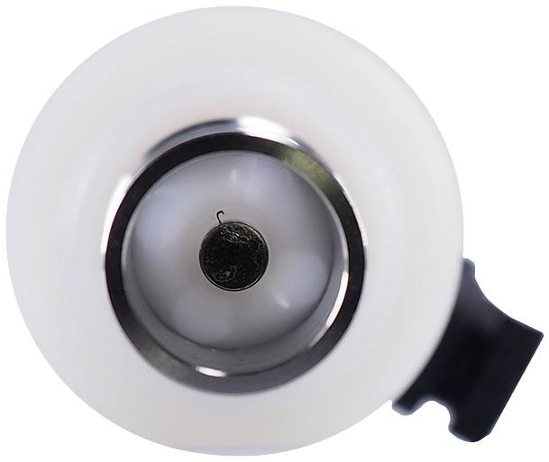 'Close-up from above of a Western candlestick': An empty, white candlestick with a central metal insert and small hook.