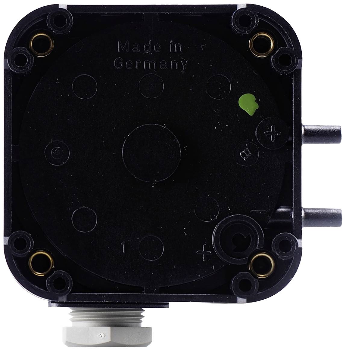 Square component, possibly an electrical or technical device, with the inscription 'Made in Germany'.