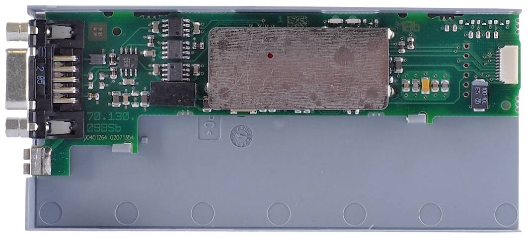 'Electronic circuit on circuit board with various components. Main circuit board with metallic protection and numerous connections.'