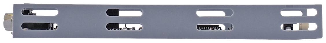 A grey metal casing with several rectangular cut-outs, partially revealing internal electronic components.