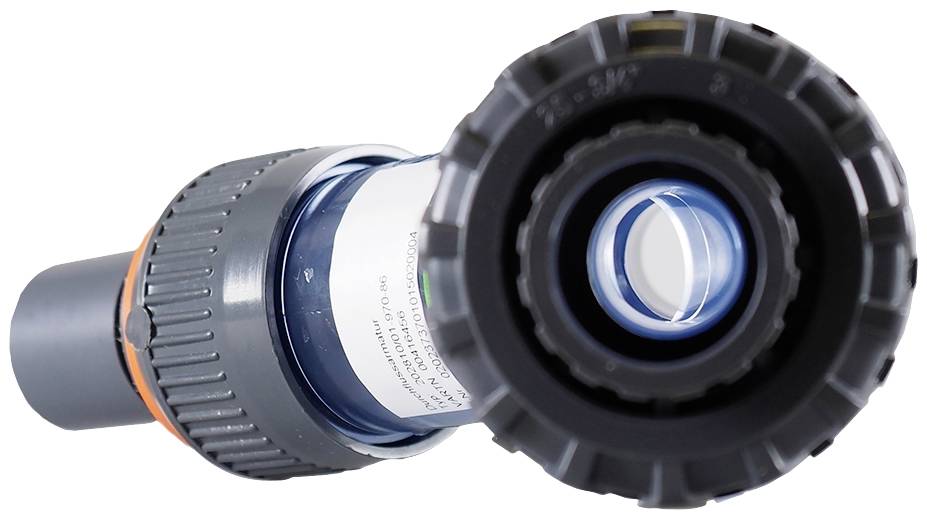 A close-up of a grey plastic connector or pipe coupling, typically used for joining pipes.