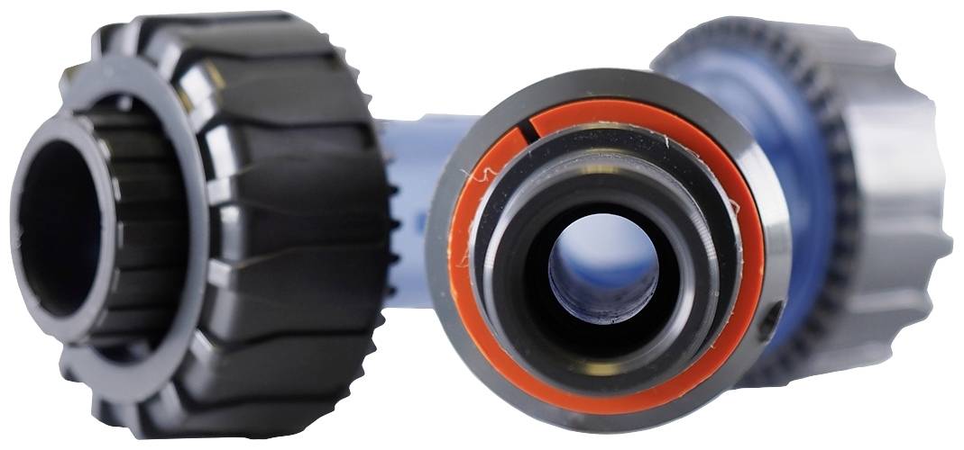 Two black plastic pipe fittings with red seals on a blue pipe section. Used for pipe connections.