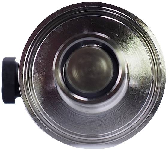 Metal tube with circular grooves, likely a machine part or technical component, viewed from above.