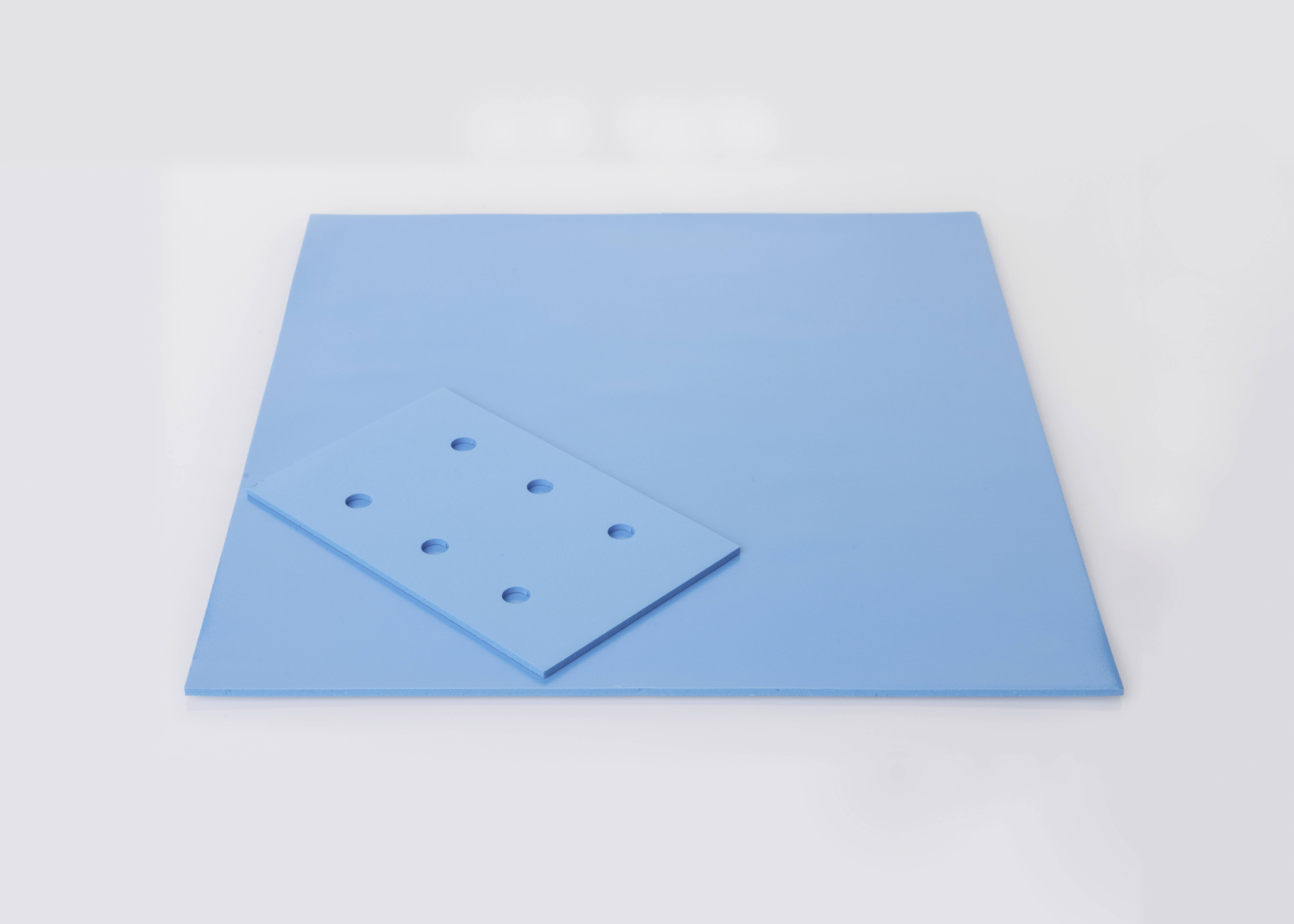 Blue square with a smaller, diagonally positioned blue plate with holes.