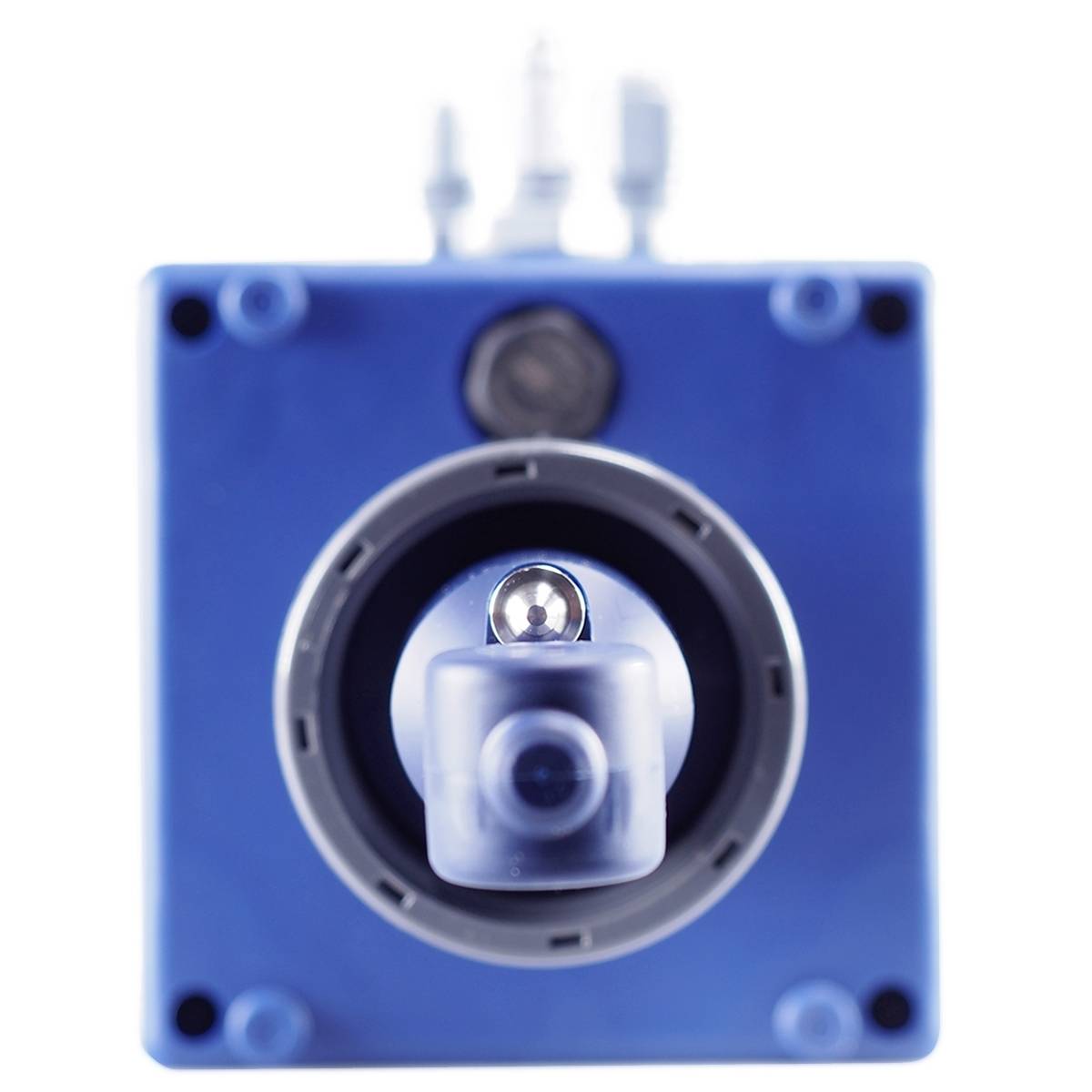 A blue device with a central, tube-like opening, from which a small, shiny sphere protrudes. Background blurred.