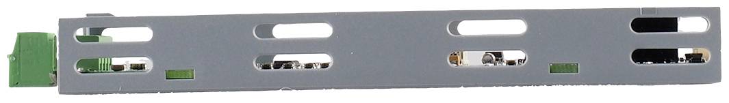 Metal panel with rectangular openings and green clips on the left side, likely part of an electronic assembly.