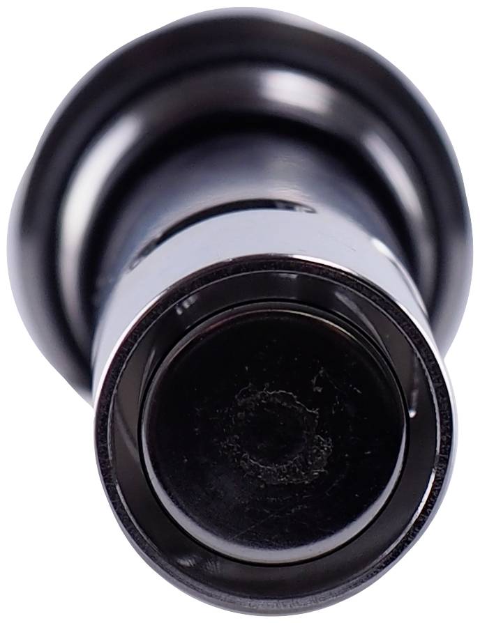 A black cylinder with a rounded edge and smooth surface, viewed from above.