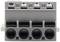 A grey electrical terminal block with four slots. Suitable for connecting wires in electrical circuits.