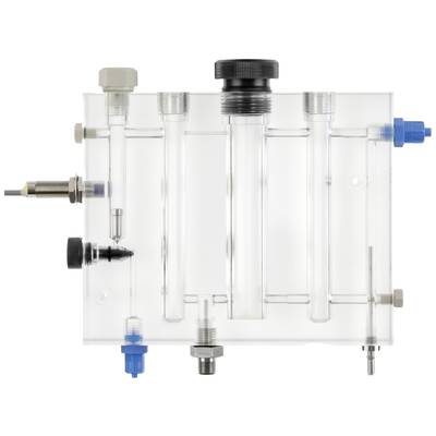 A transparent device with multiple connections and tubes, likely part of a scientific or technical apparatus.