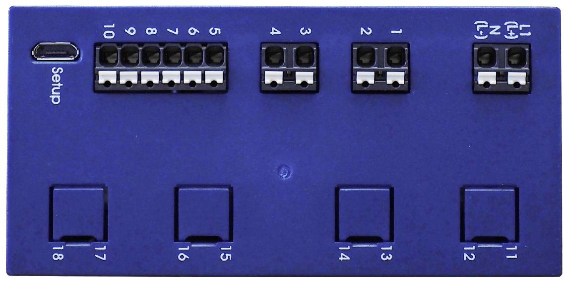 Blue electronic device with multiple ports. At the top is a USB port labelled 'Setup'. Markings for positions 1-18.