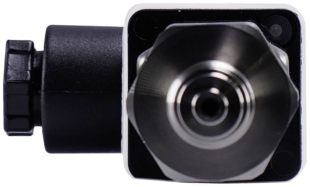 Close-up of a mechanical component made of metal with black and silver parts. The top surface displays a hexagonal shape.