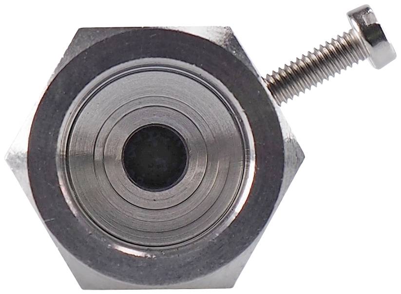 Metal hexagonal nut with a recessed screw head, focused on the central aperture.