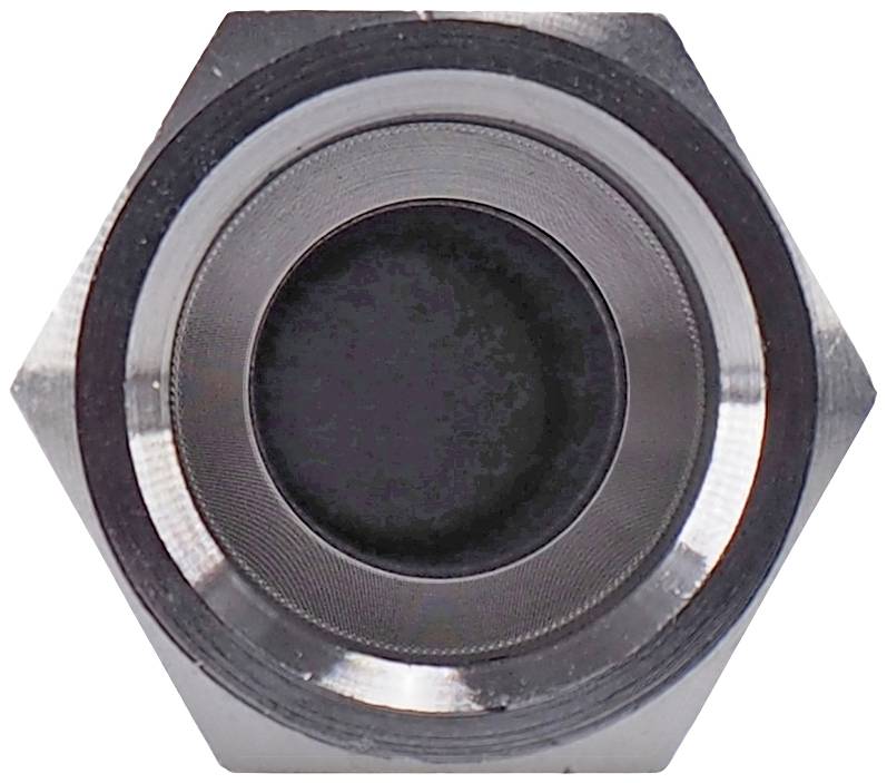 Close-up of a metallic hexagonal nut with a dark centre, revealing detailed texture and surface of the material.