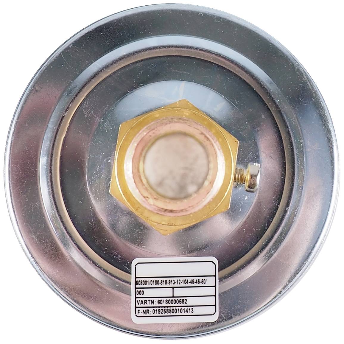 Close-up of a round metal component with a central golden hexagonal bolt and a label number at the bottom.