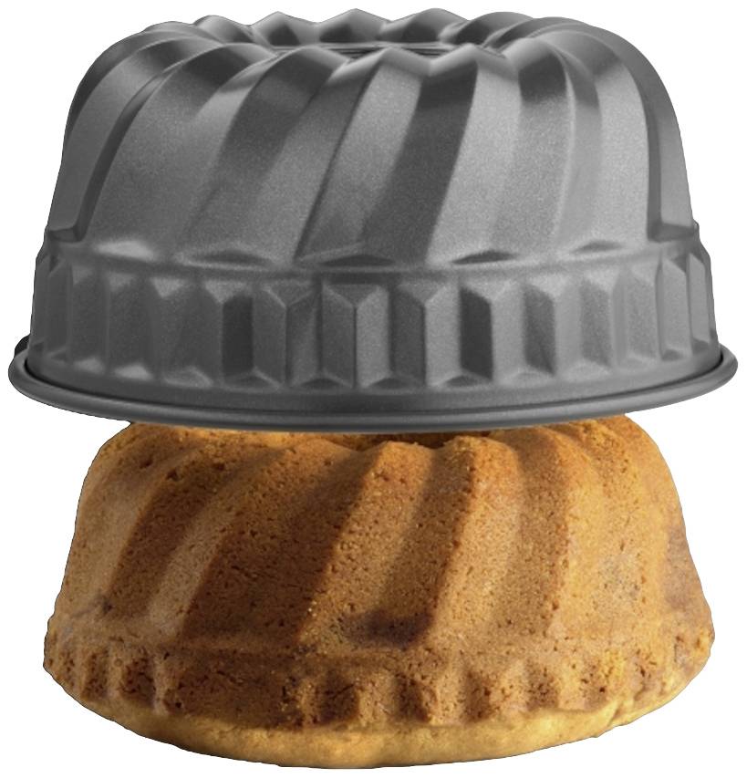 A freshly baked cake is lifted from a round, fluted bundt tin.