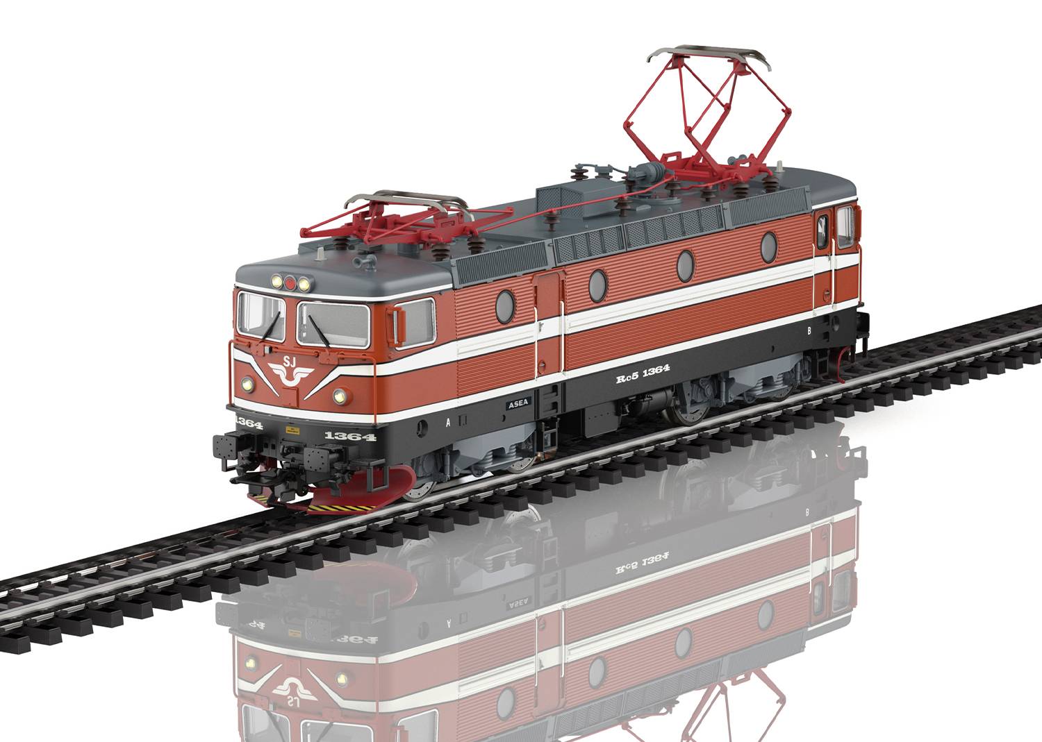 A red and white model of an electric locomotive on a track, with detailed overhead lines and a reflective ground surface.