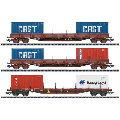 Three railway carriages on tracks, laden with coloured containers bearing the labels 'CAST', 'CMA CGM', 'CTI' and 'Hapag-Lloyd'.