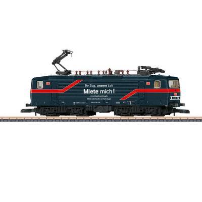 A dark blue electric locomotive with a red stripe and the inscription 'Your train, our engine. Hire me!' is moving along the tracks.