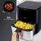 An XXL hot air fryer with a pulled-out drawer full of chips and an image of chicken wings, 5.0 litre capacity.
