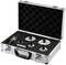 An aluminium case with foam lining contains several round hole saw attachments and a drill.