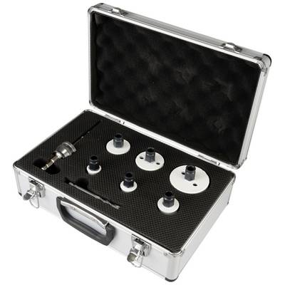 An open silver case with foam lining displays several round drill crown attachments and tool accessories, neatly arranged.
