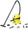 A yellow vacuum cleaner with a hose and various attachments, including a floor brush and a charging unit, on a white background.