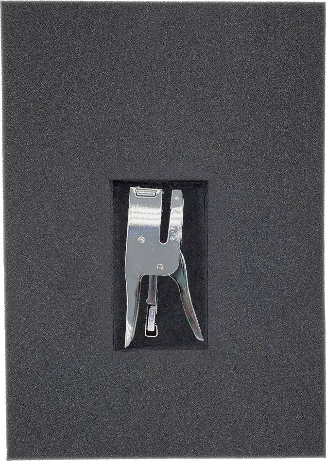 A silver stapler centred in a rectangular foam insert, presented on a black background.