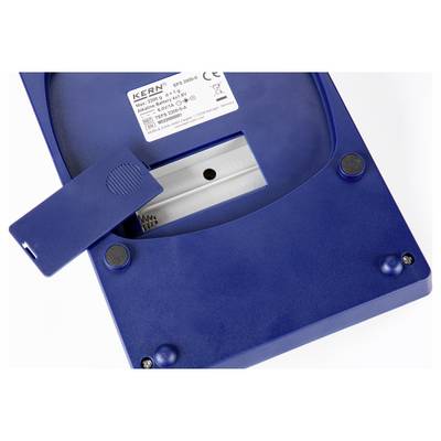 A blue electronic device, possibly a scale, with its battery compartment open. Manufacturer label reads 'Kern ETS 1000-3'.