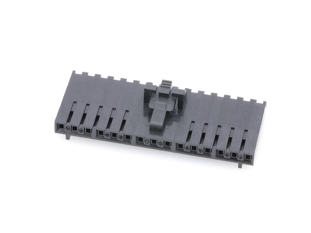 A black plastic multi-pin connector lying on a white background, for electronic applications.