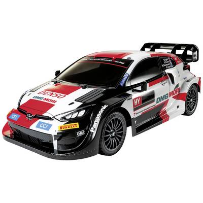A rally car with red, black, and white design, sponsored by brands such as 'DENSO', 'DMG MORI', and 'Panasonic'.