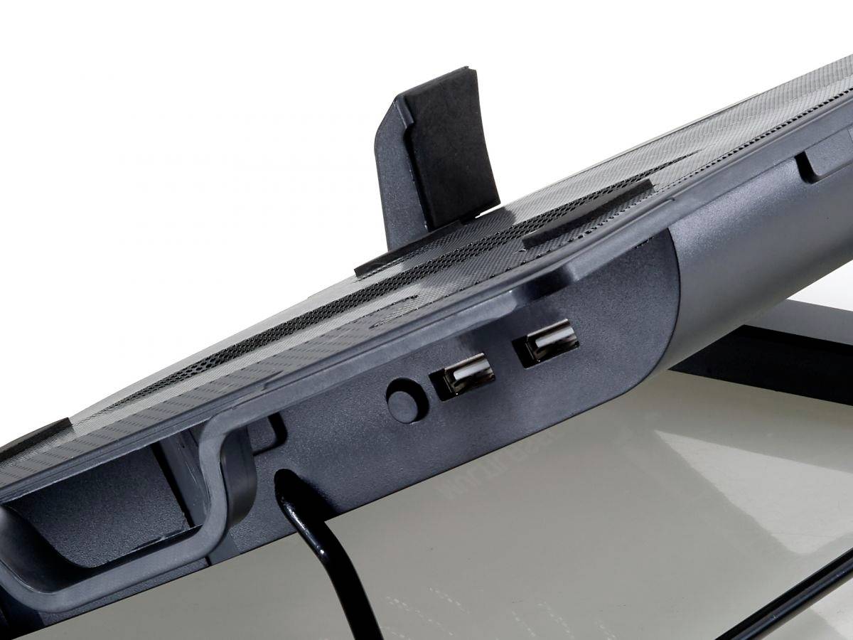 Ventilated laptop stand with two USB ports and cable, raised to improve air circulation. Suitable for desk work.