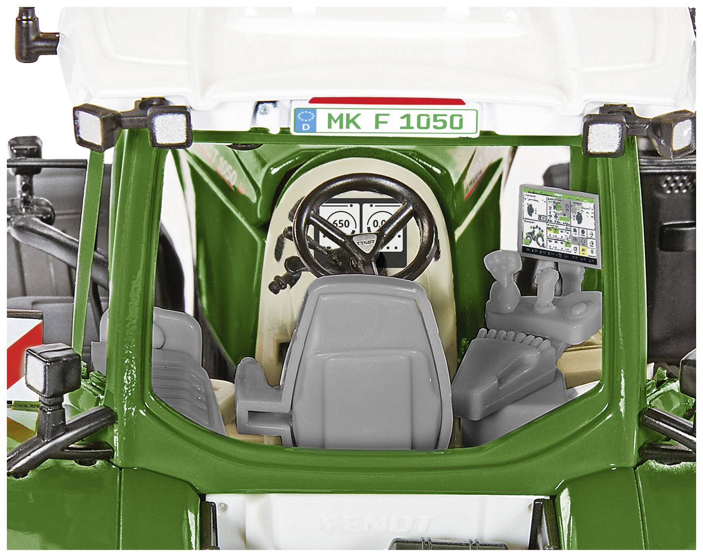 Rear view inside the cab of a green agricultural vehicle with a grey seat and open doors, with control elements visible.