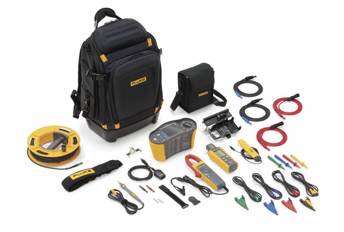 An electrical measuring instrument set is laid out, including a rucksack, cables, and accessories. Ideal for technicians' diagnostic work.