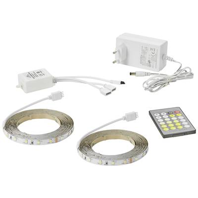 Two LED strips with remote control and power supply, laid out. Represents a lighting set controllable via remote control.