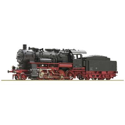 A black steam locomotive with red wheels and red elements stands on railway tracks, side view.