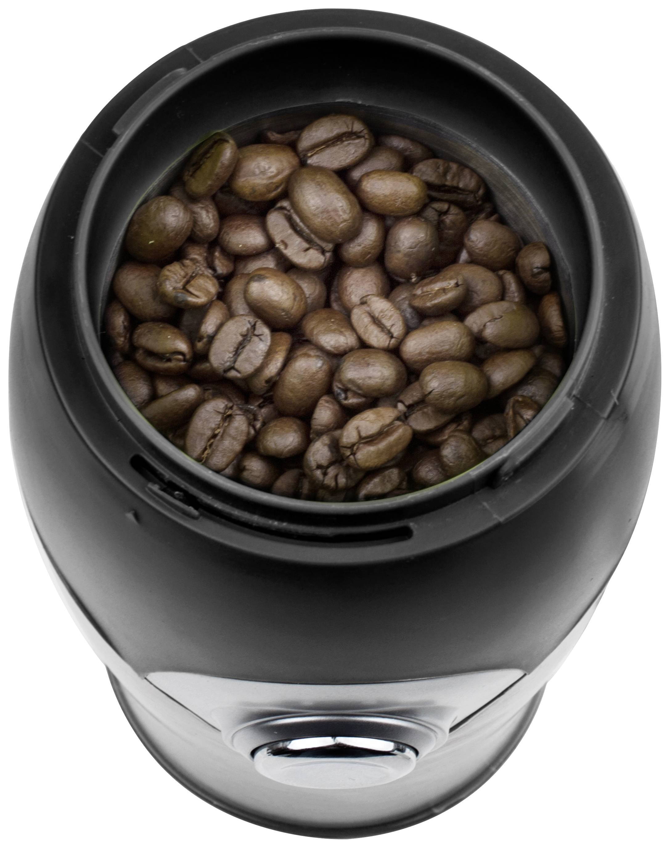Black coffee grinder with coffee beans in the grinding container, viewed from above.