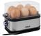 An electric egg cooker with a transparent lid containing seven eggs. The cooker has a stainless steel casing and a blue button.