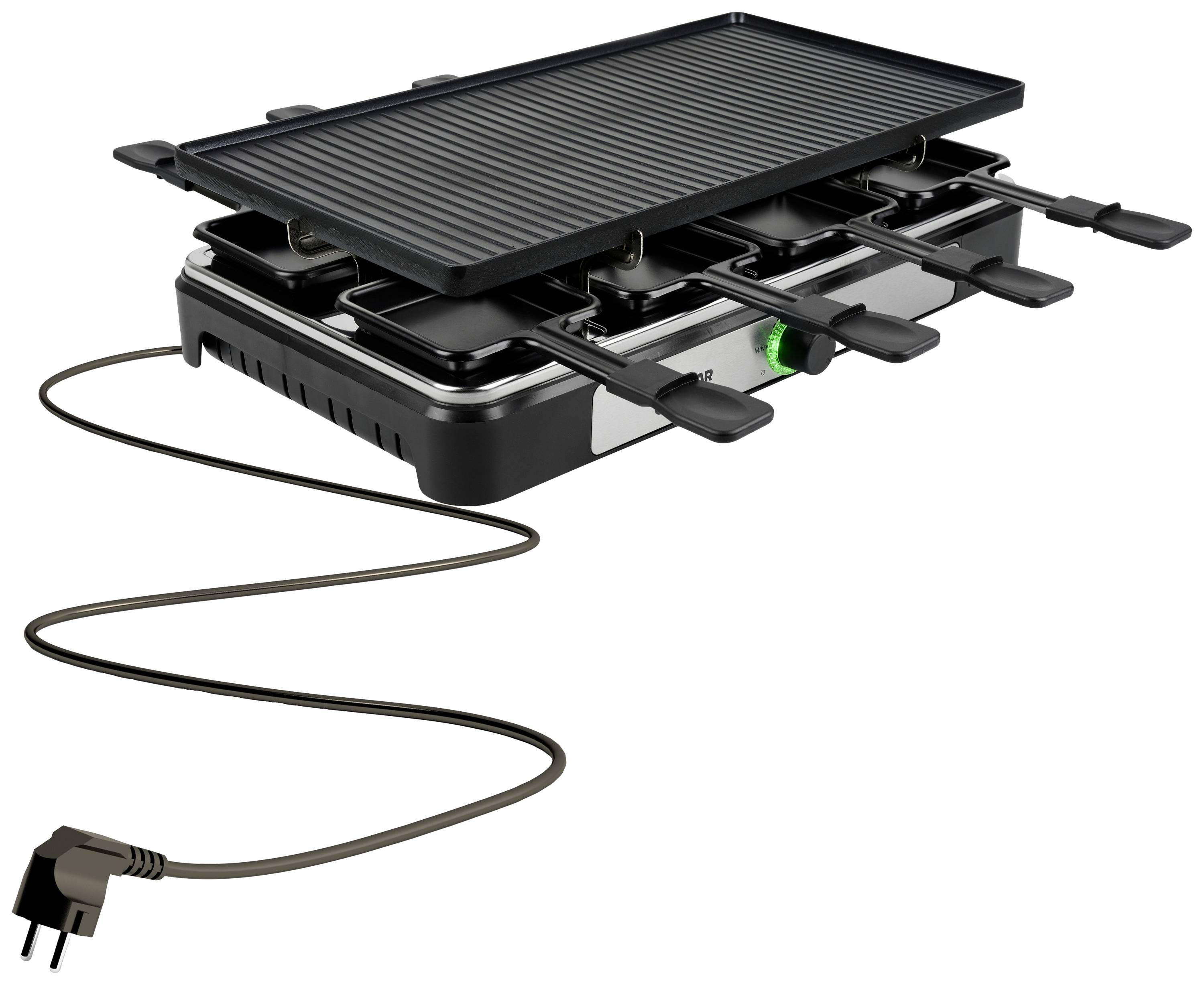 Raclette grill with several small pans, plugged into an electrical cable, ready for use on a table.