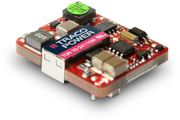 A red Traco Power module, a voltage converter, with various electronic components, including capacitors and resistors.