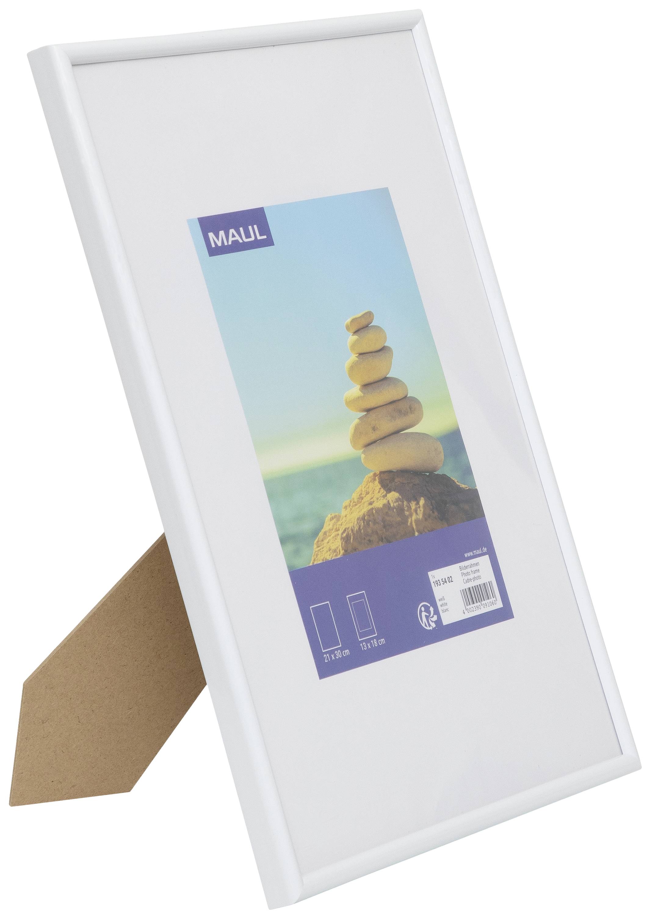 Picture frame with a white border, placed on a table. An image of stacked stones by the sea is included as the sample picture.