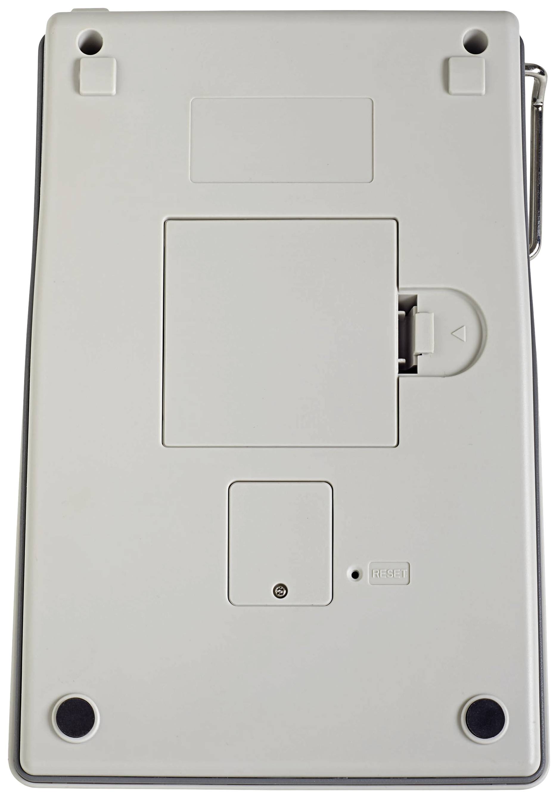Back of an electronic device, possibly a calculator or similar device, with a battery compartment and four rubber feet.