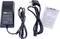 A black power supply with cable, plug and user manual. Suitable for electrical devices. Contains technical specifications.