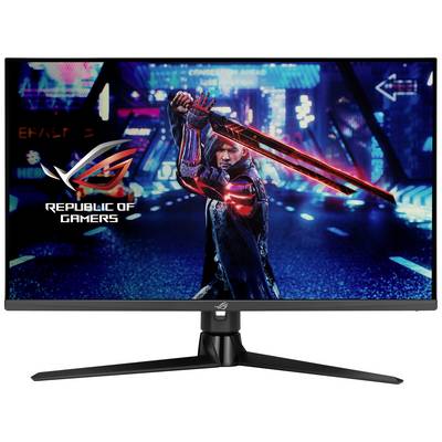 A gaming monitor displays a futuristic video game with a character holding a glowing sword in a digital city.