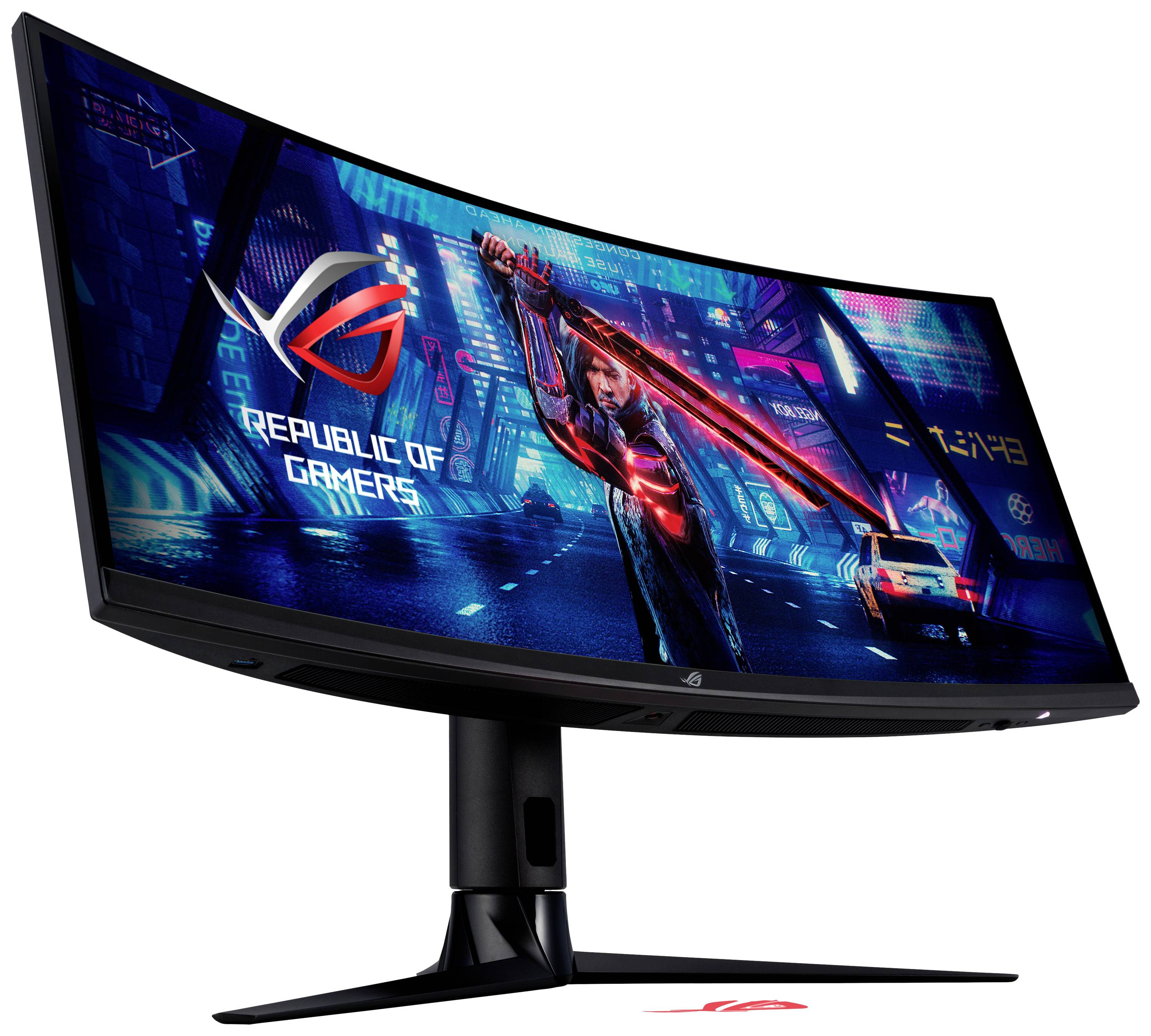 Wide gaming monitor with futuristic city backlighting and 'Republic of Gamers' logo on the screen.