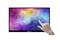 A hand touches the screen of a flat monitor displaying a colourful, abstract pattern.
